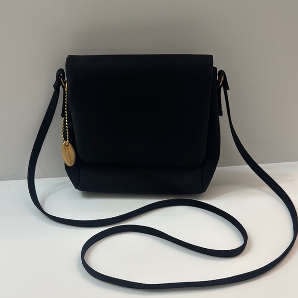 Liz Claiborne Handbags - Liz Claiborne Elegant Black Crossbody Bag. Gold colored accents. Skinny strap.